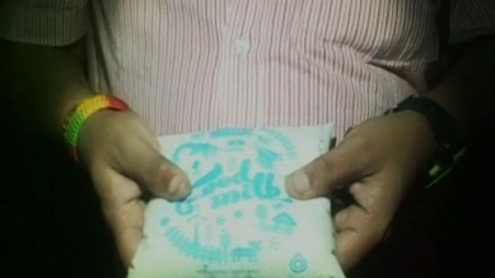 Consumer holding a Mother Dairy milk packet in Agra. (Courtesy: ANI)