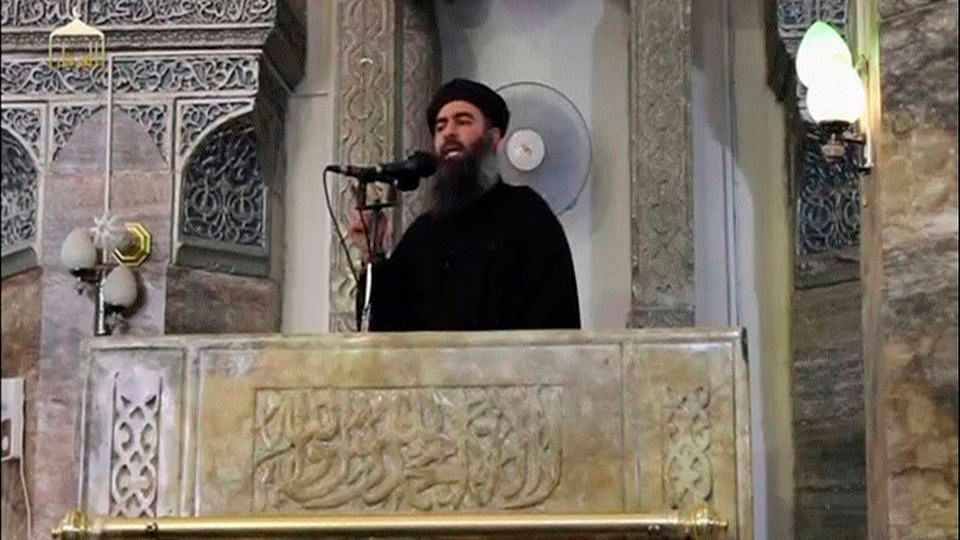 Islamic State leader Abu Bakr al-Baghdadi speaks to a gathering of supporters. (Photo: YouTube Screengrab)