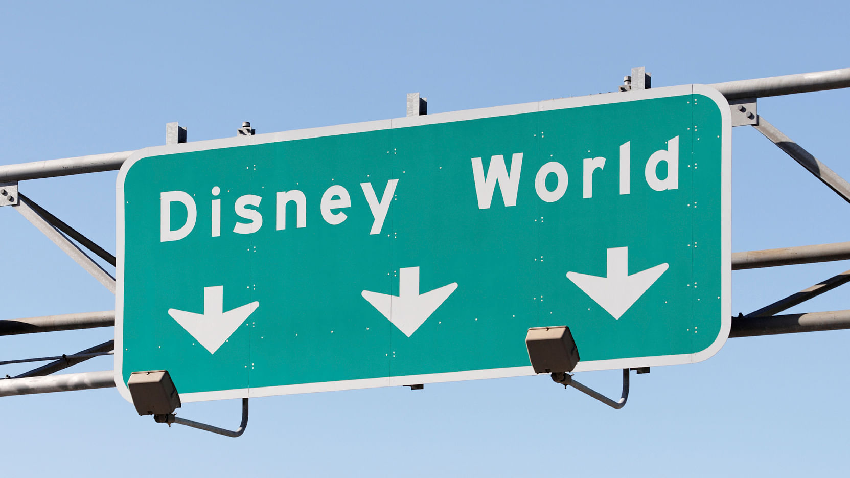 Orlando, Florida, USA - December 22, 2011: A highway sign points the way to the Walt Disney World Resort. Located in Lake Buena Vista, Florida, The Walt Disney World Resort is the world\’s most visited entertainment resort. (Photo:iStock)
