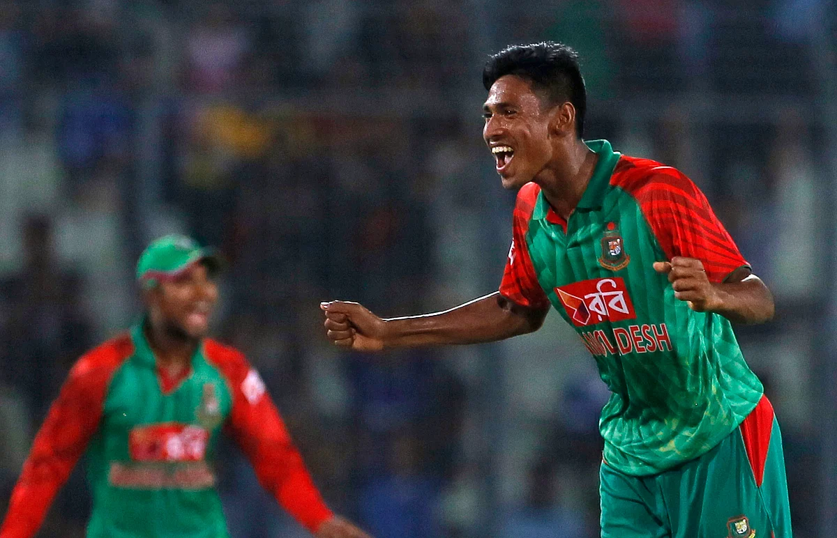 Bangladesh’s Mustafizur Rahman, right, celebrates the dismissal of India’s Rohit Sharma. (Photo: AP)