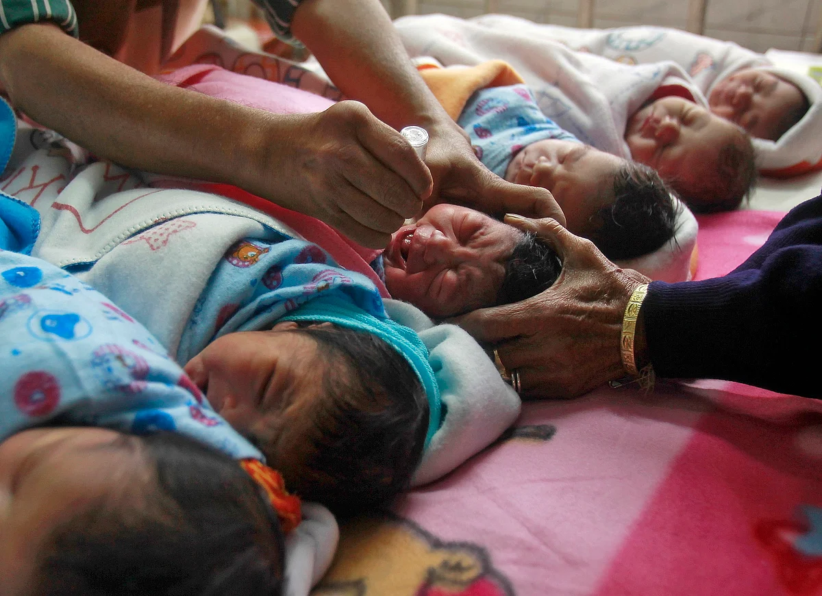 A medical worker administers polio drops to an infant at a hospital during the pulse polio immunization programme in Agartala. (Photo: Reuters)