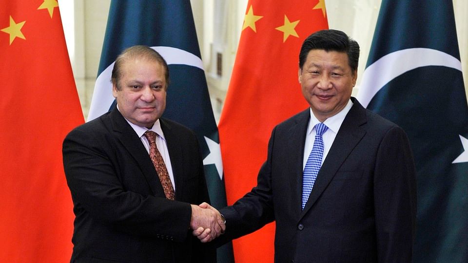 Pakistan’s former Prime Minister Nawaz Sharif (L) shakes hands with China’s President Xi Jinping in this file photo.