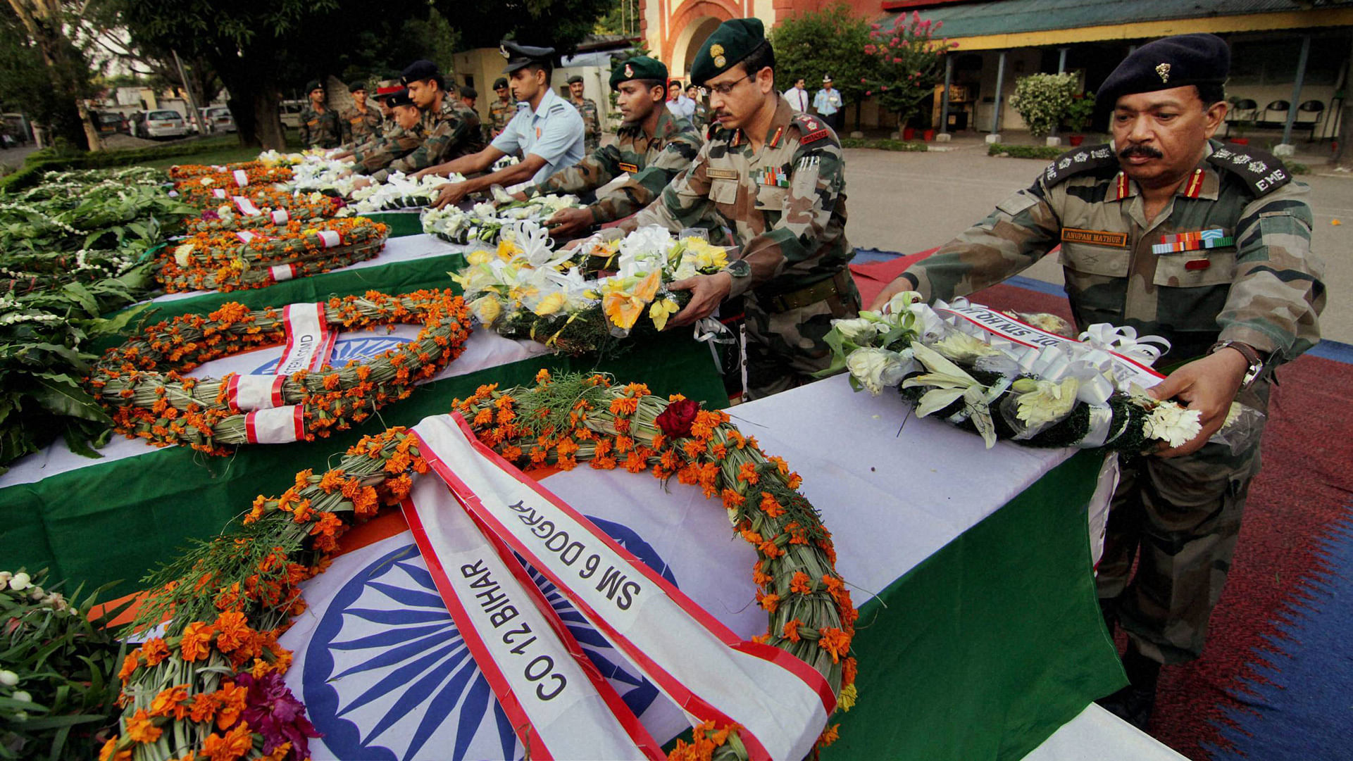 Army officers pay tribute in Jammu on Sunday to the soldiers killed in Thursday’s ambush in Manipur. (Photo: PTI)