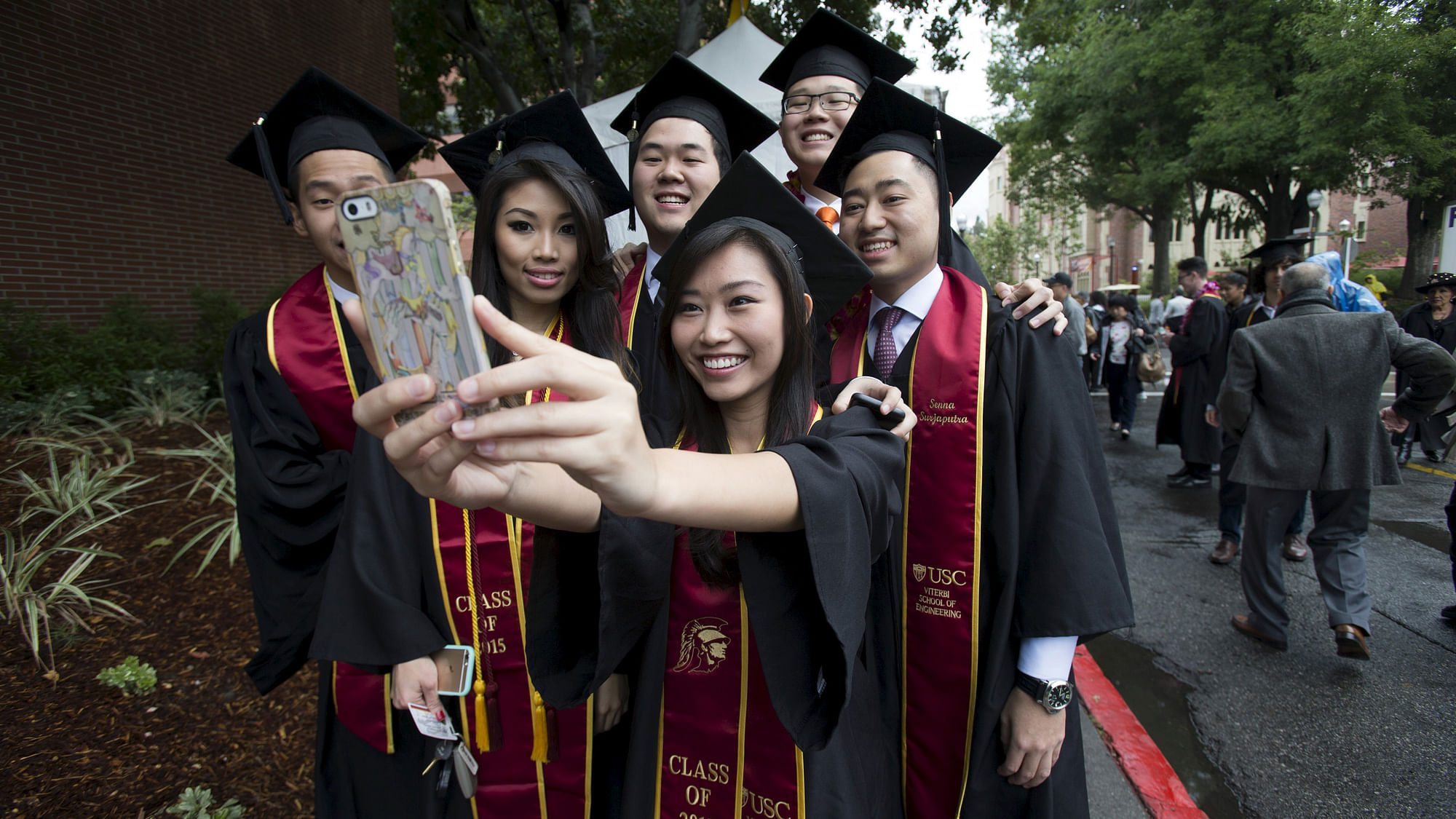 Graduating students take a selfie following USC’s Commencement Ceremony at University of Southern California in Los Angeles, California May 15, 2015. (Photo: Reuters)