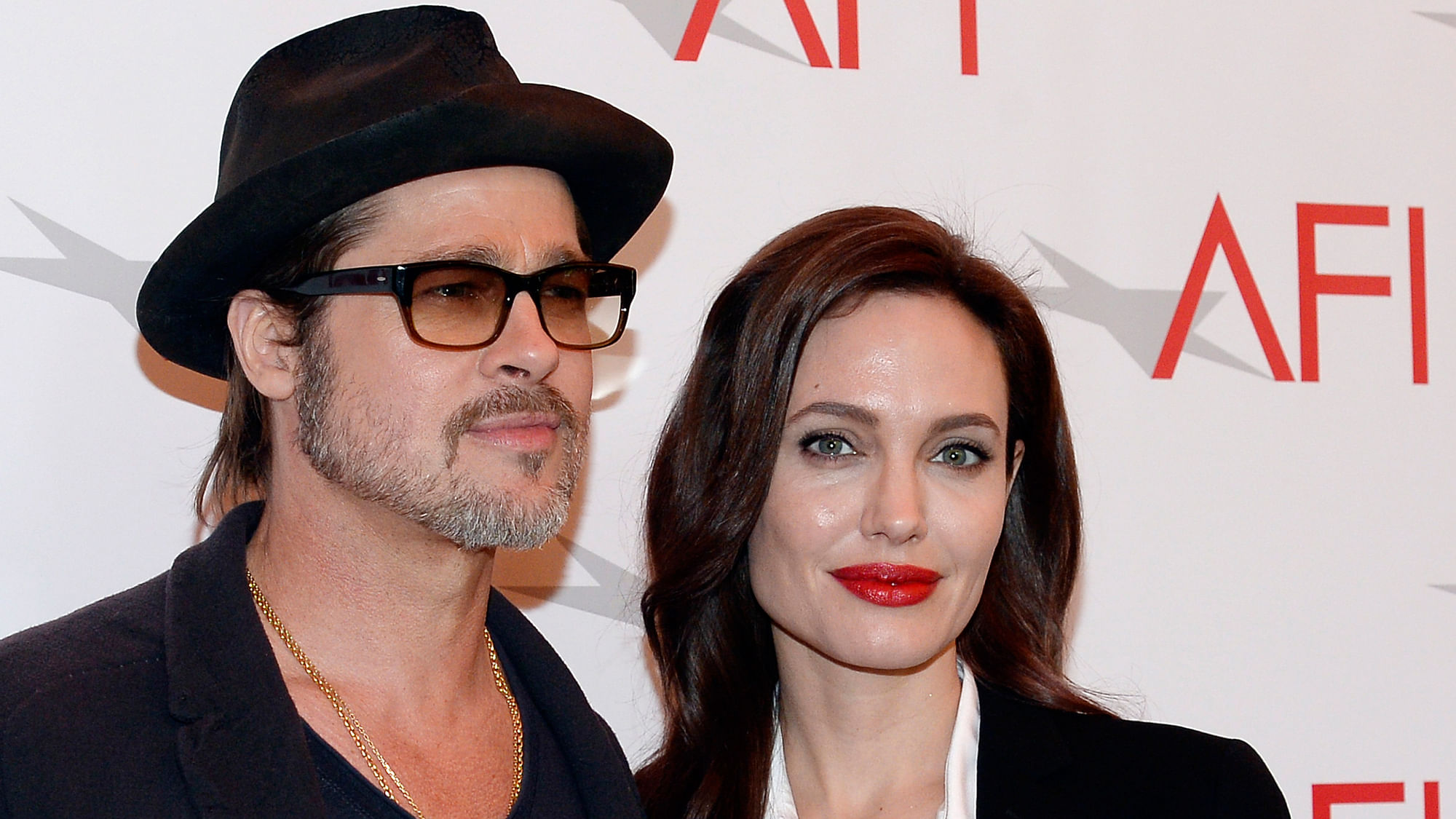 Actor Brad Pitt and actress/director Angelina Jolie pose at the AFI Awards 2014. (Photo: Reuters)