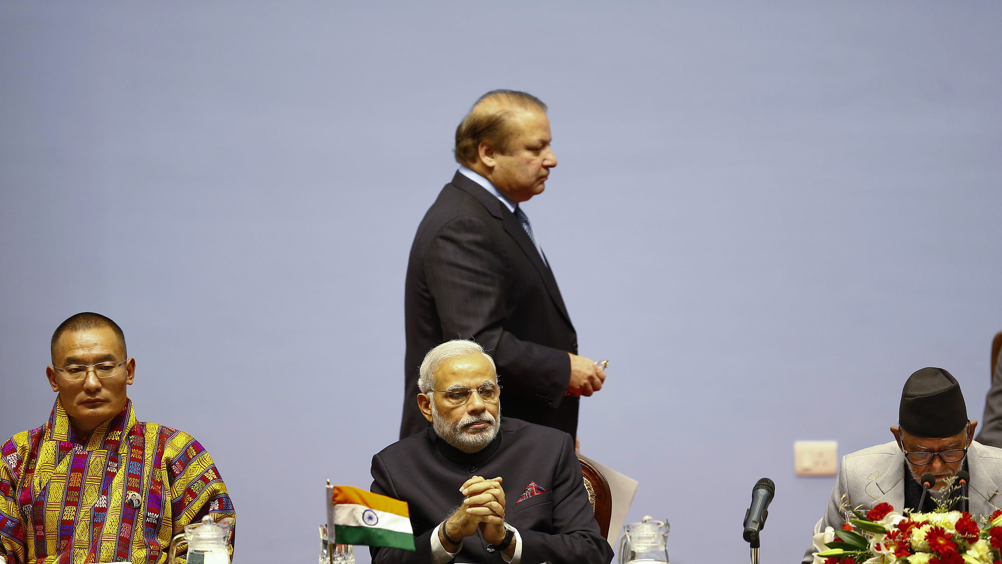 Prime Minister Nawaz Sharif walks past Prime Minister Narendra Modi. (Photo: Reuters)