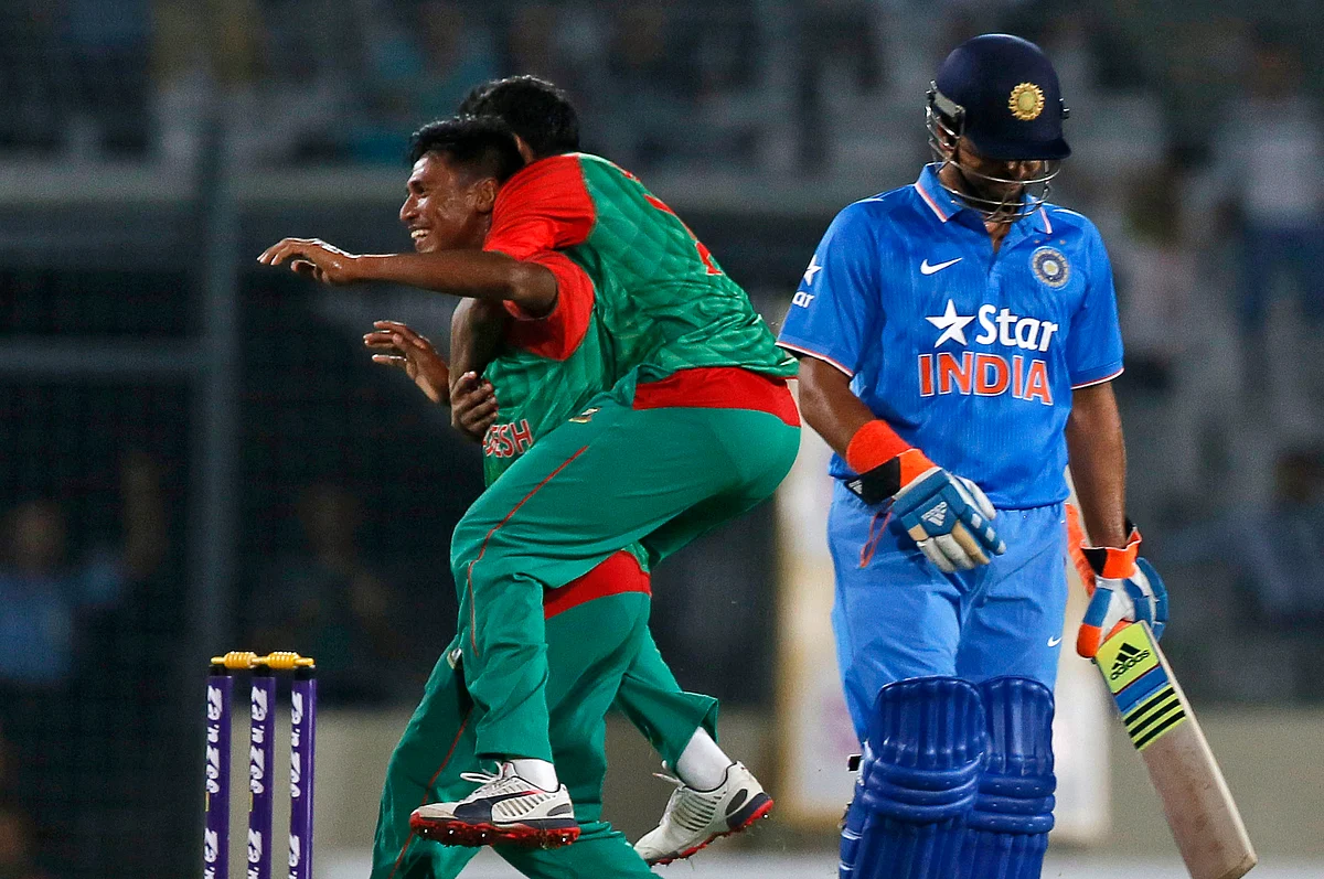 Bangladesh’s Mustafizur Rahman celebrates the dismissal of Suresh Raina. (Photo: AP)