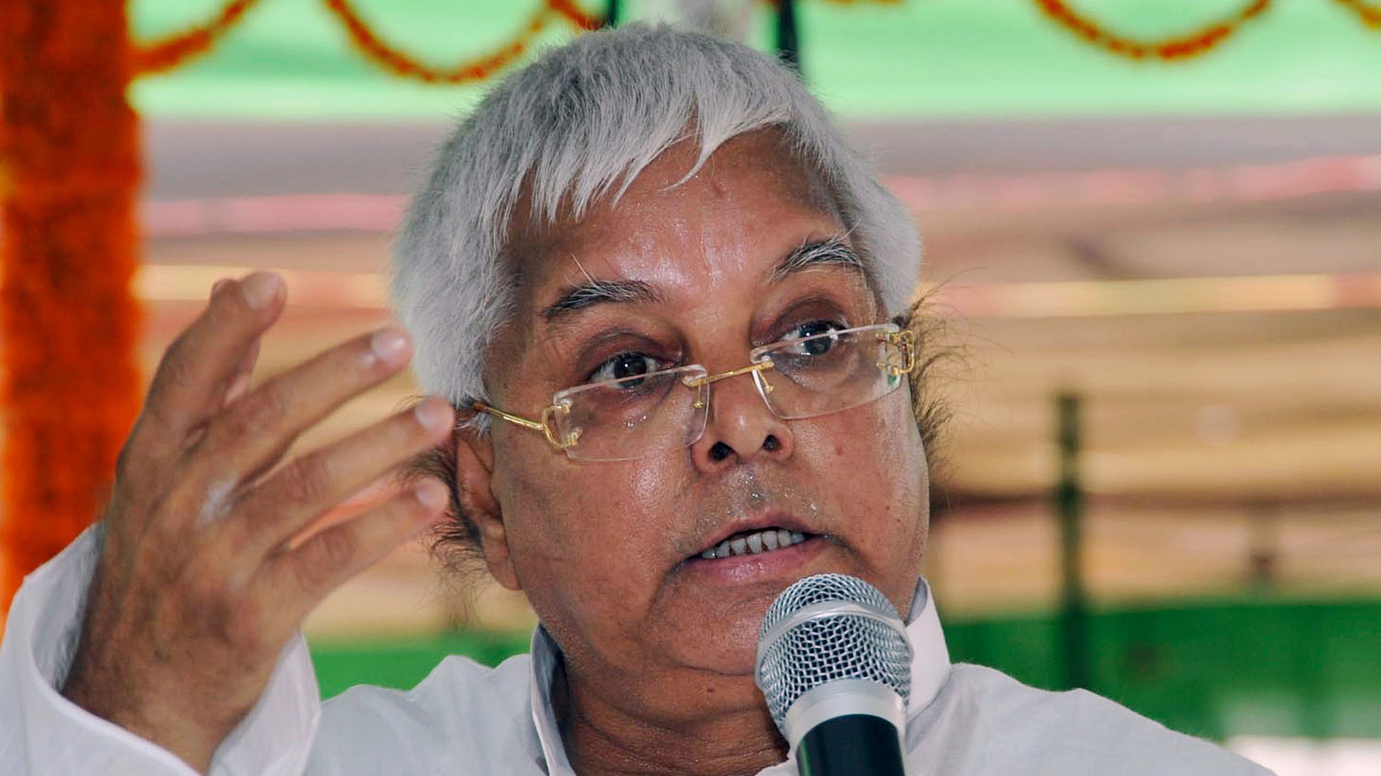 Rashtriya Janata Dal (RJD) chief Lalu Prasad Yadav speaks during a meeting with his party workers. (Photo: Reuters)