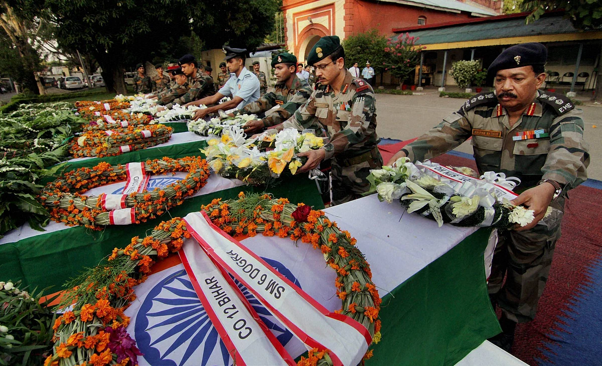 Army officers pay tribute to soldiers killed in Thursday’s ambush in Manipur. (Photo: PTI)