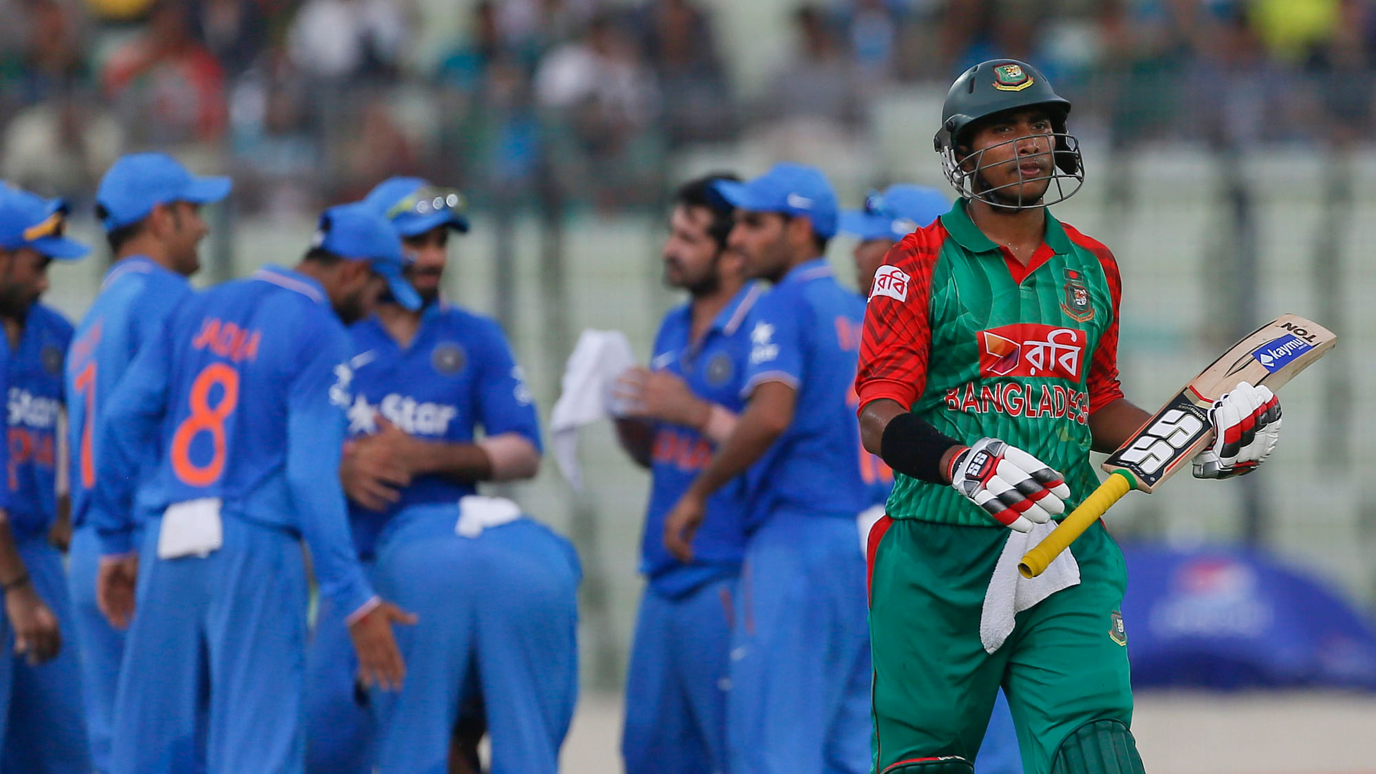 Bangladesh’s Soumya Sarkar walks back after his dismissal by Suresh Raina during the first ODI in Dhaka. (Photo: AP)