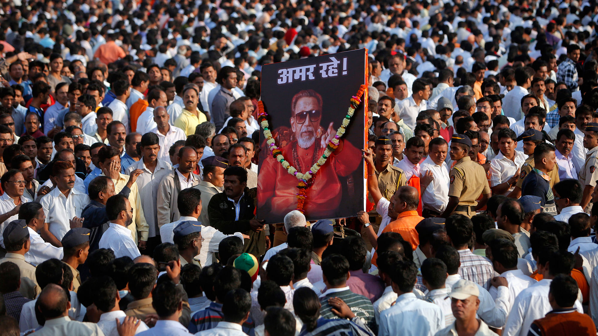 Shiv Sena supporters carrying a picture of late Bal Thackeray. (Photo: Reuters)
