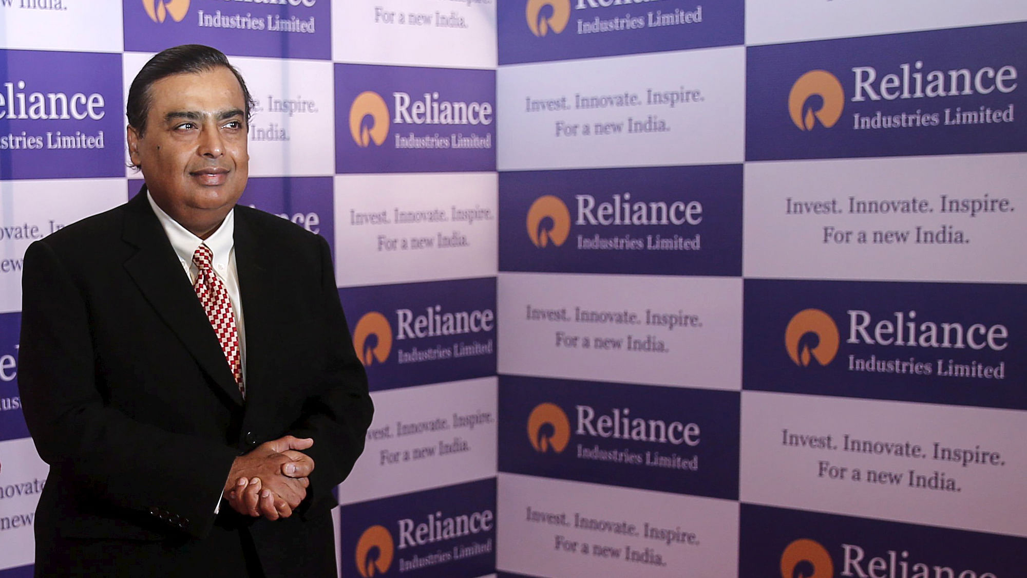Mukesh Ambani, chairman of Reliance Industries Limited, poses for photographers before addressing the annual shareholders meeting in Mumbai, India, 12 June, 2015.&nbsp;