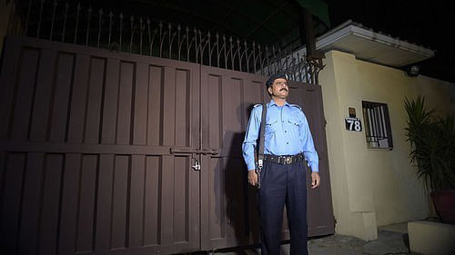 Security official outside the&nbsp;sealed Islamabad office of Save the Children. (Photo: <i>The Dawn</i>)