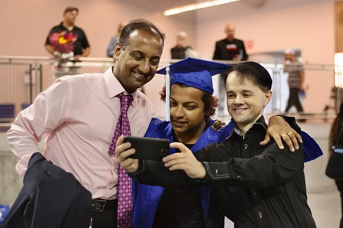 Bony on his graduation day with Mikel and a friend. (Photo: Smita Sharma)
