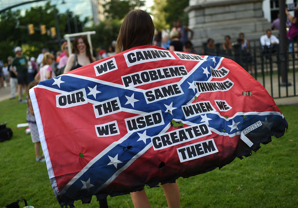 Charleston church shooting brings calls for Confederate flag to be removed from South Carolina’s State House grounds.