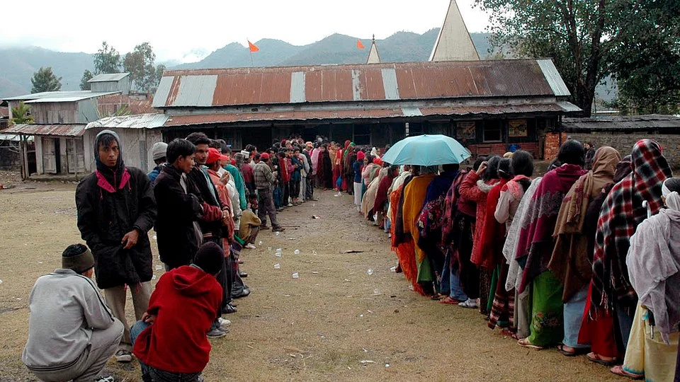 Voters stand in a queue outside a polling station at Ukhrul in Manipur. (Photo: Reuters) 