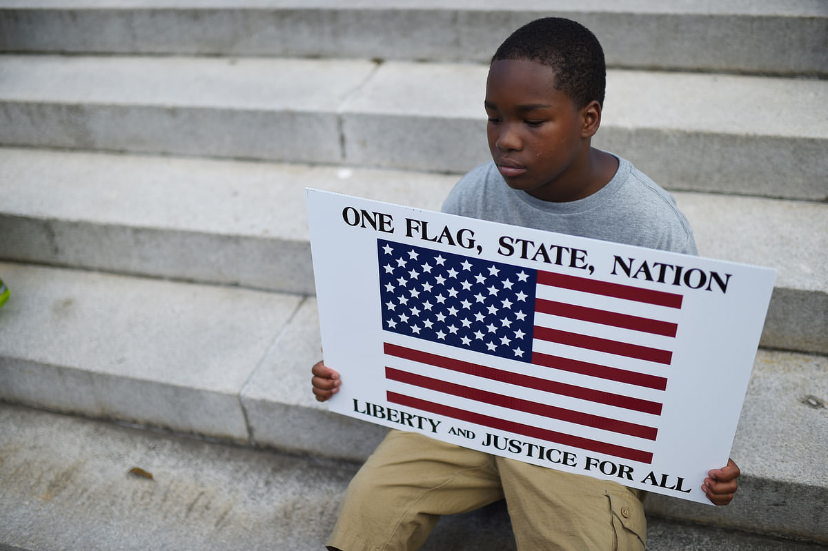 Charleston church shooting brings calls for Confederate flag to be removed from South Carolina’s State House grounds.