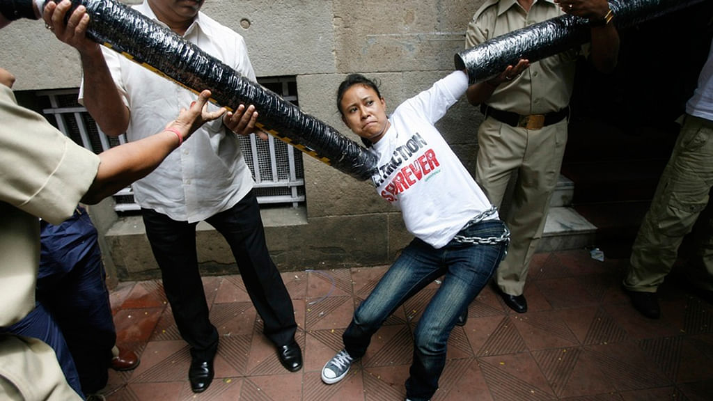 File image of security personnel trying to restrain a Greenpeace activist during a blockade of the Tata Group’s HQ in Mumbai. (Photo: Reuters)