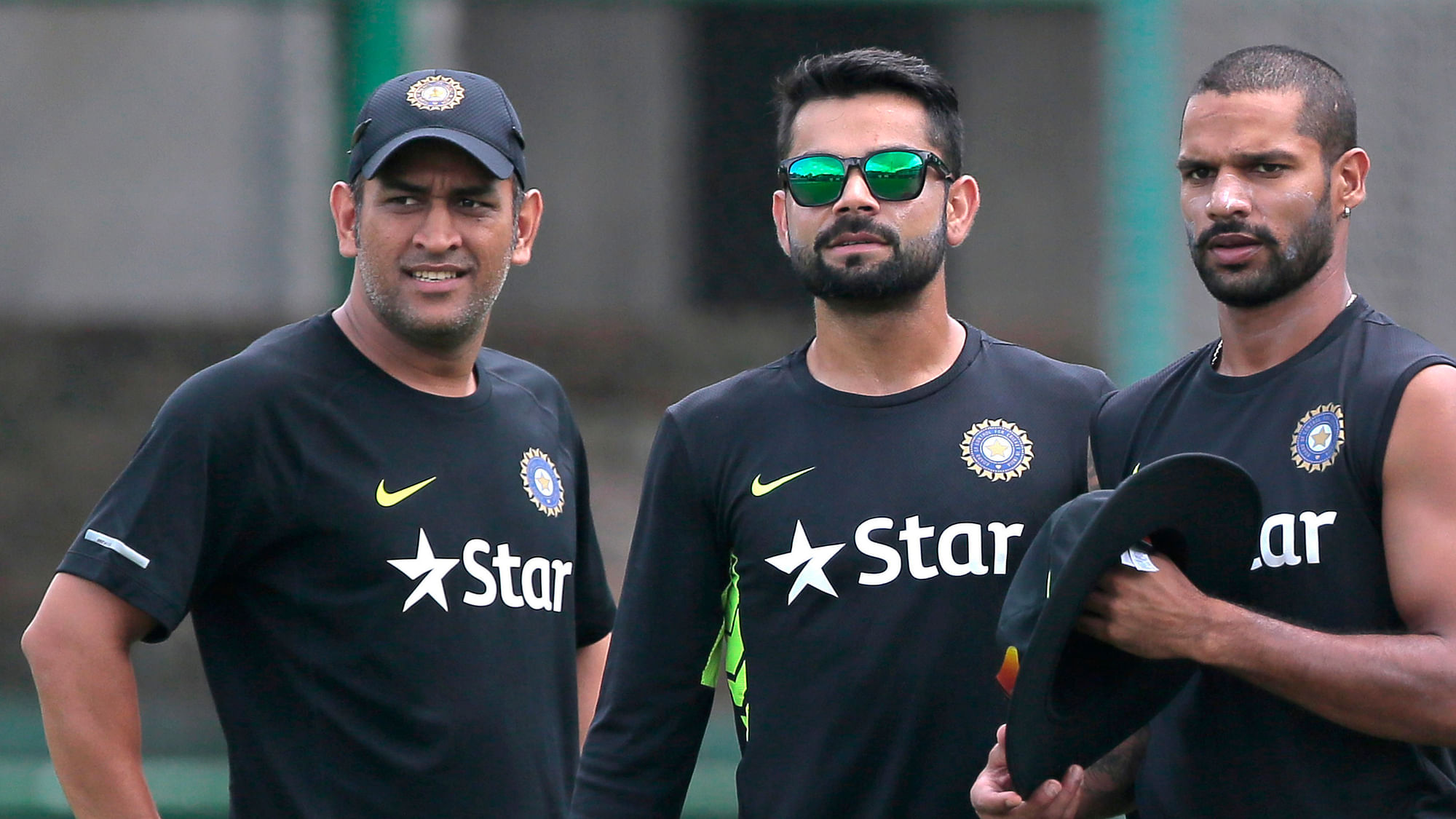 Indian skipper MS Dhoni with Virat Kohli and Shikar Dhawan at a nets session on Wednesday. (Photo: AP)