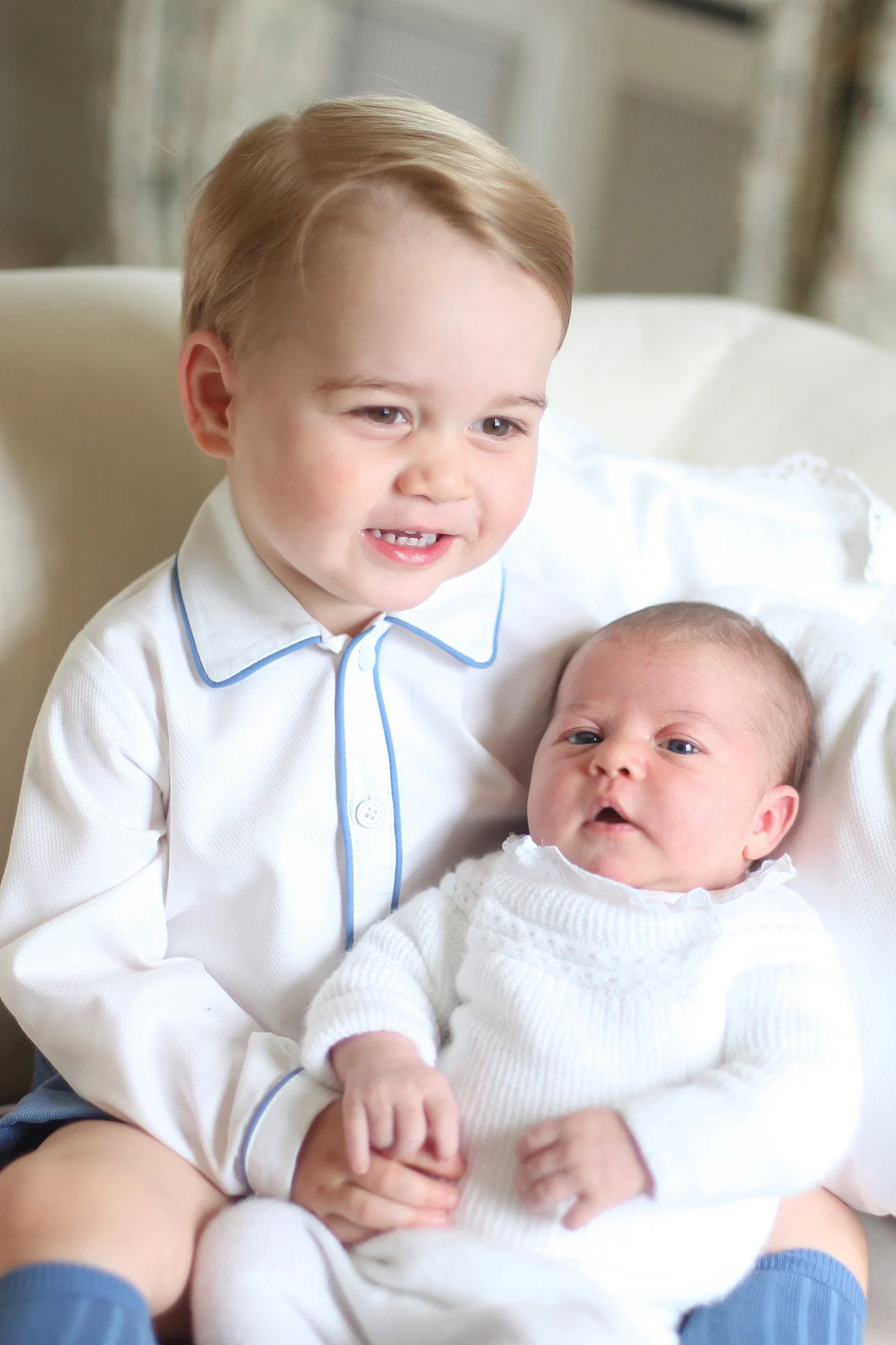 Cheery big brother Prince George looks adorable with his little sister Princess Charlotte. (Photo: Reuters)