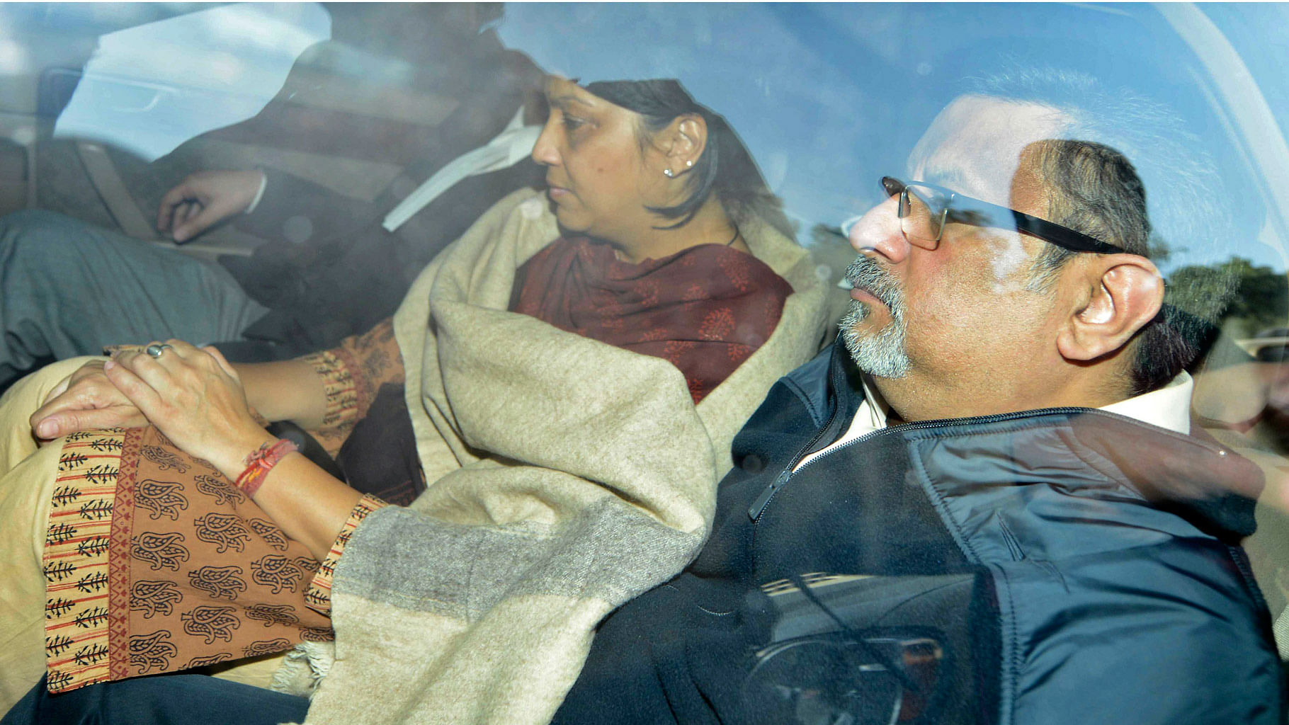 File picture of Aarushi’s parents Rajesh Talwar (R) and Nupur (L) being taken to a court in 2013.