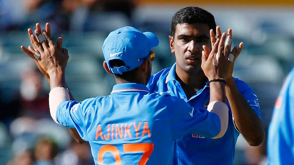 Ashwin celebrates with team mate Ajinkya Rahane after bowling out UAE in the 2015 ICC World Cup. (Photo: Reuters)