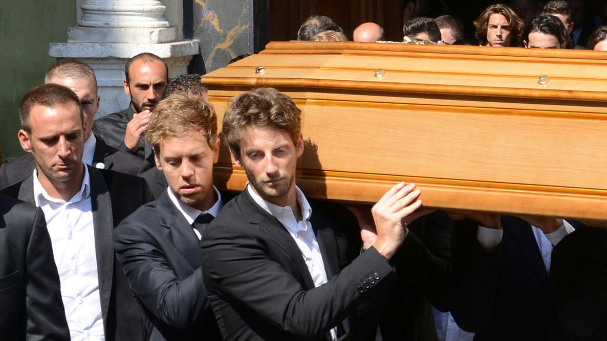 Formula One drivers Sebastian Vettel(L ) and Romain Grosjean (3rdL)&nbsp;carry the coffin of late Marussia F1 driver Jules Bianchi during the funeral ceremony at the Sainte Reparate Cathedral in Nice, France. (Photo: Reuters)