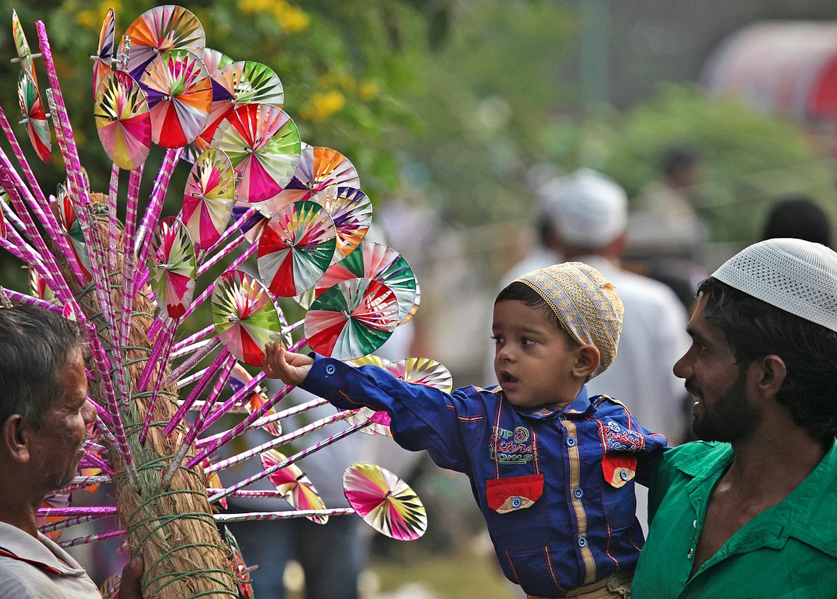 A Muslim boy buys a paper fly-wheel during the celebrations to mark Eid al-Adha in the northern Indian city of Chandigarh October 6, 2014. Muslims around the world celebrate Eid al-Adha by the sacrificial killing of sheep, goats, cows and camels to commemorate Prophet Abraham’s willingness to sacrifice his son Ismail on God’s command. (Photo: Reuters)