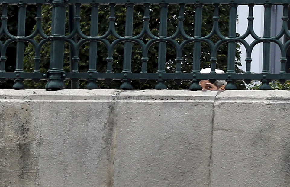 US Secretary of State John Kerry looks at journalist as he sits at the garden of the hotel where the Iran nuclear talks meetings are being held in Vienna. (Photo: Reuters)