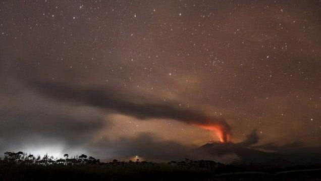 Volcanic ash and clouds are illuminated by lava from the crater of Mount Raung on the main island of Java, Indonesia. (Photo: Reuters)