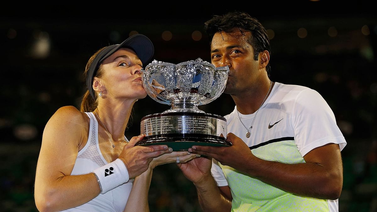 Both partnering Martina Hingis, Leander Paes and Sania Mirza are through to the finals of two different draws.