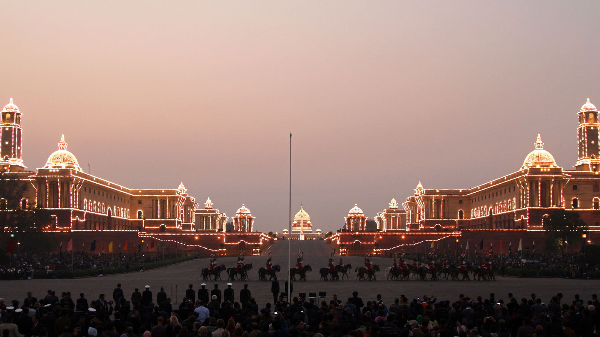The Indian Defence Ministry (L), Home Ministry (R) and Presidential Palace (C) buildings are illuminated during the full-dress rehearsal for the “Beating the Retreat” ceremony in New Delhi. (Photo: Reuters)