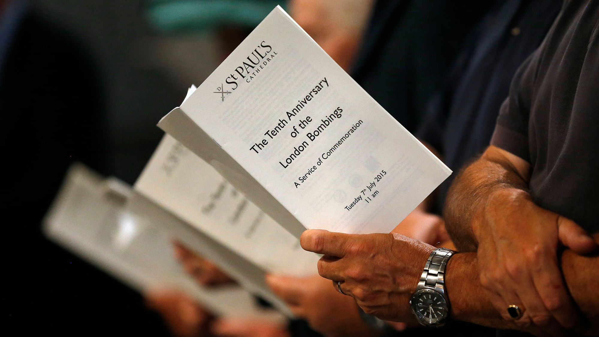 Visitors hold the schedule during a service in St Paul’s Cathedral, London to commemorate the 12th anniversary of the London bombings. (Photo: AP)