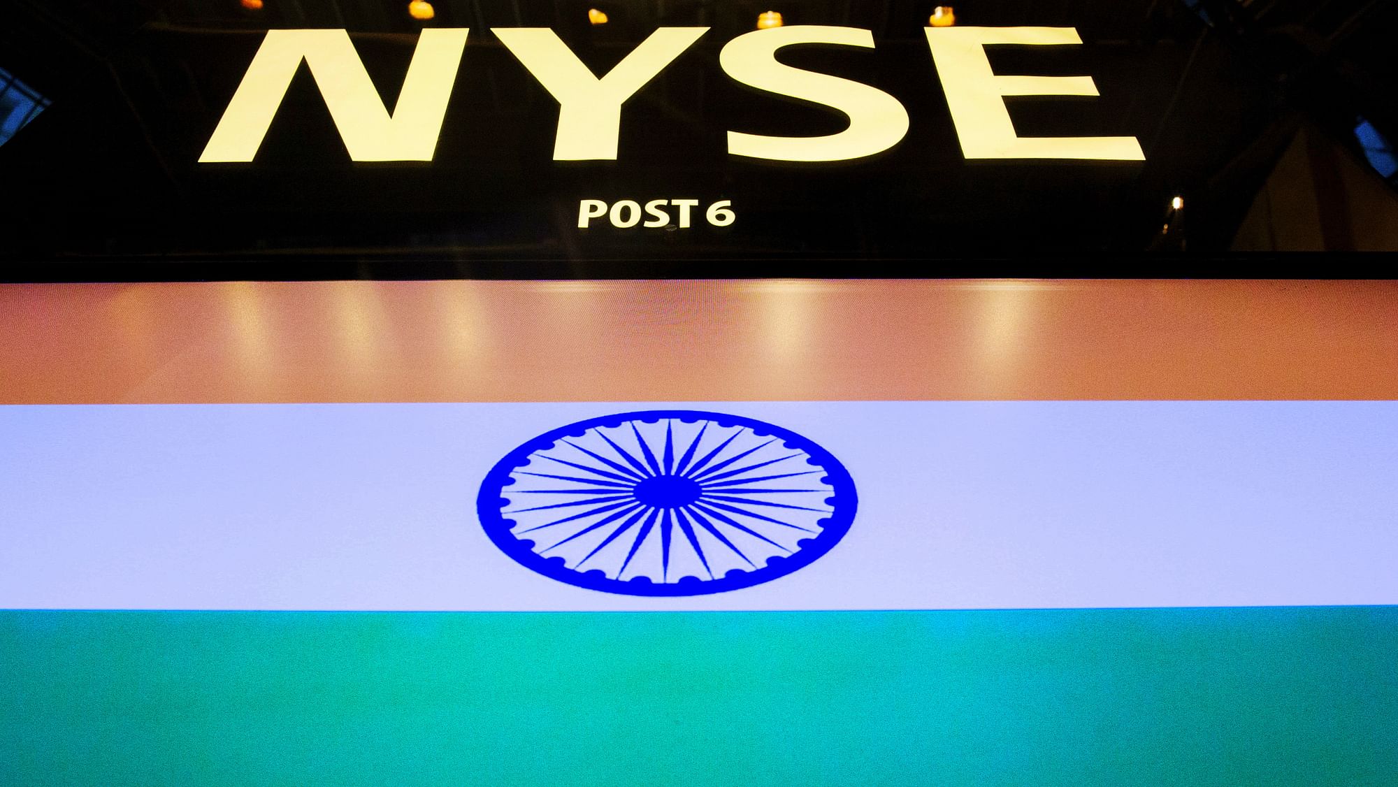 The initials of the New York Stock Exchange are seen above a display of India’s national flag on the main trading floor at the New York Stock Exchange June 17, 2015. (Photo: Reuters)