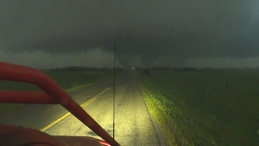 A group Canadian storm chasers chase a storm in their truck. (Photo courtesy: AP Screen grab)