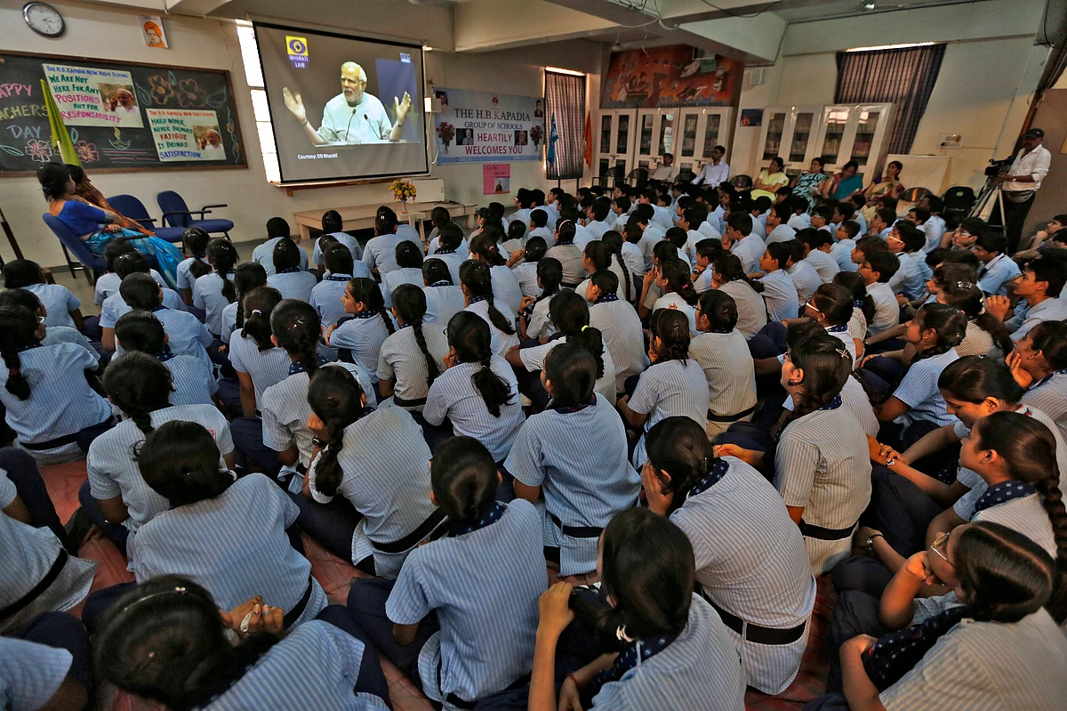 Students watch Indian Prime Minister Narendra Modi on screen as he speaks during a nationwide address to school children during Teachers’ Day in the western Indian city of Ahmedabad September 5, 2014. (Photo: Reuters)