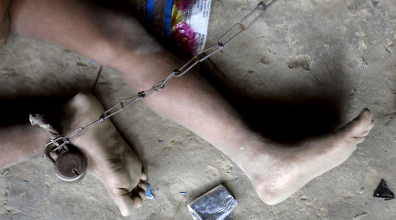 2014 Siliguri: 8-year-old Shomvu Sharkar is chained inside his hut. Shomvu is mentally ill and gets epileptic seizures multiple times a day (Photo: Reuters)