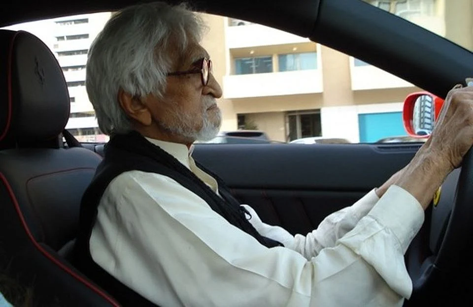 MF Husain driving his Ferrari. 
