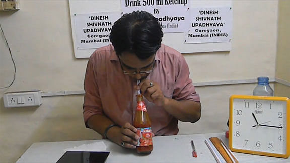 Dinesh Upadhyay gulps down a bottle of ketchup in a record breaking&nbsp;30 seconds. (Photo: AP screengrab)