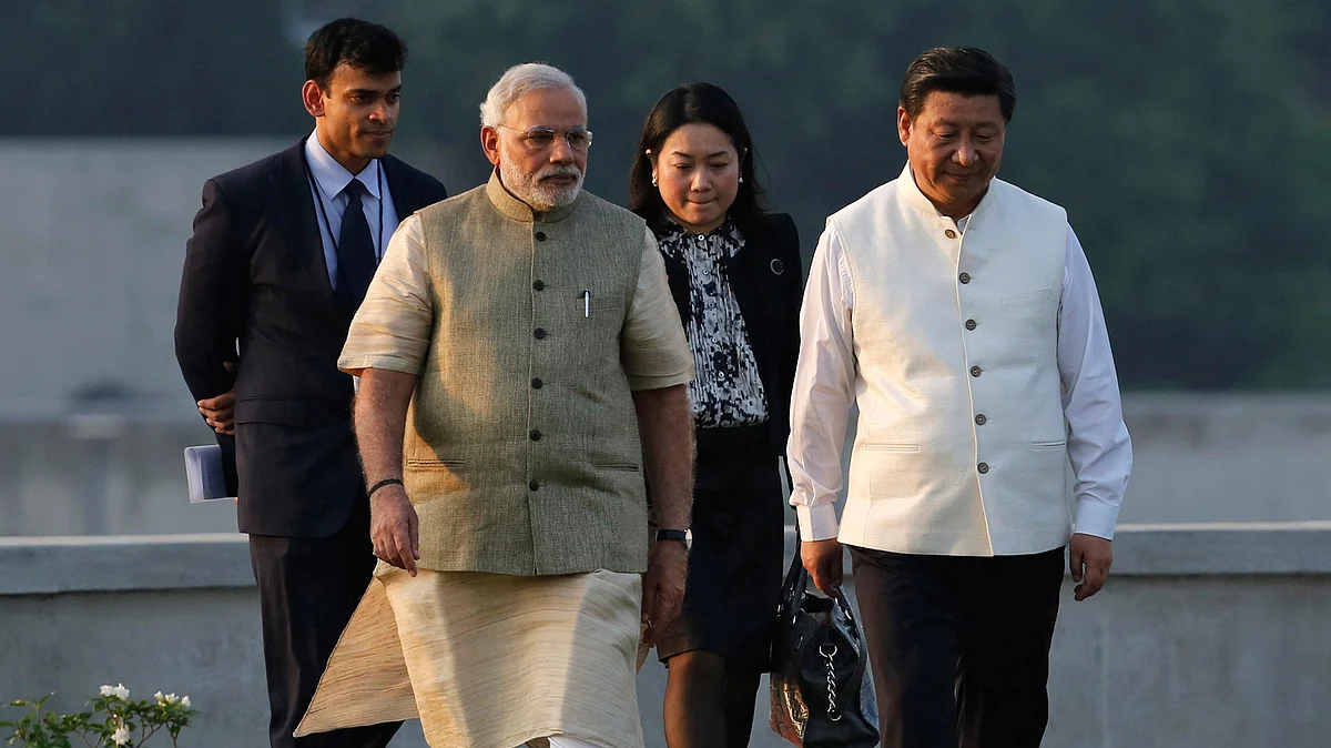India needs to act cautiously on the AIIB initiative as China has been accused of economic coercion in the past. China’s President Xi Jinping with PM Modi in Ahmedabad, September, 2014 (Courtesy: Reuters)