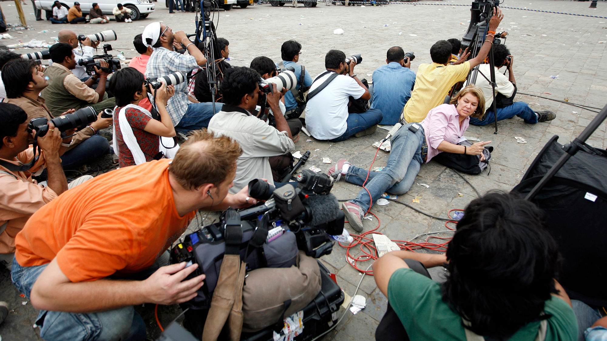 Media covering the Taj Hotel attack in the middle of a gunfight in Mumbai, November 2008. (Photo: Reuters) 