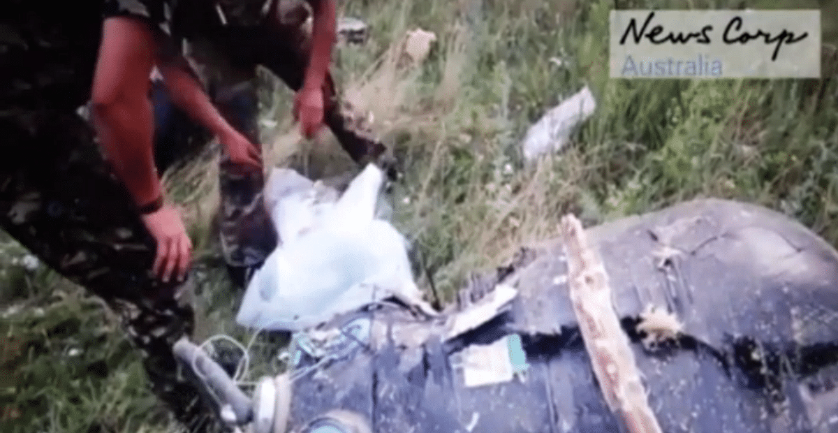 A video of pro-Russian rebels rummaging through the remains of MH17 passengers released.