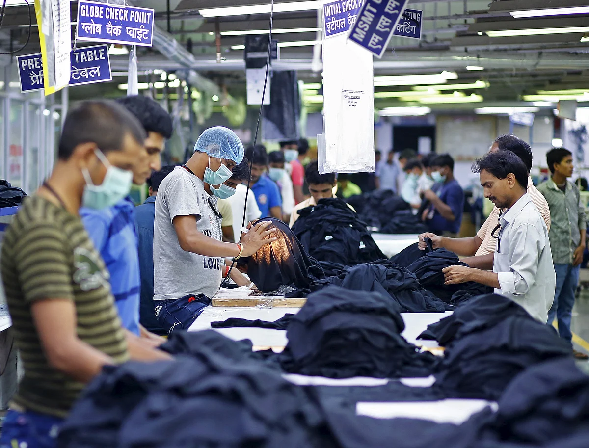 Employees work inside a garment factory of Orient Craft Ltd. (Photo: Reuters)