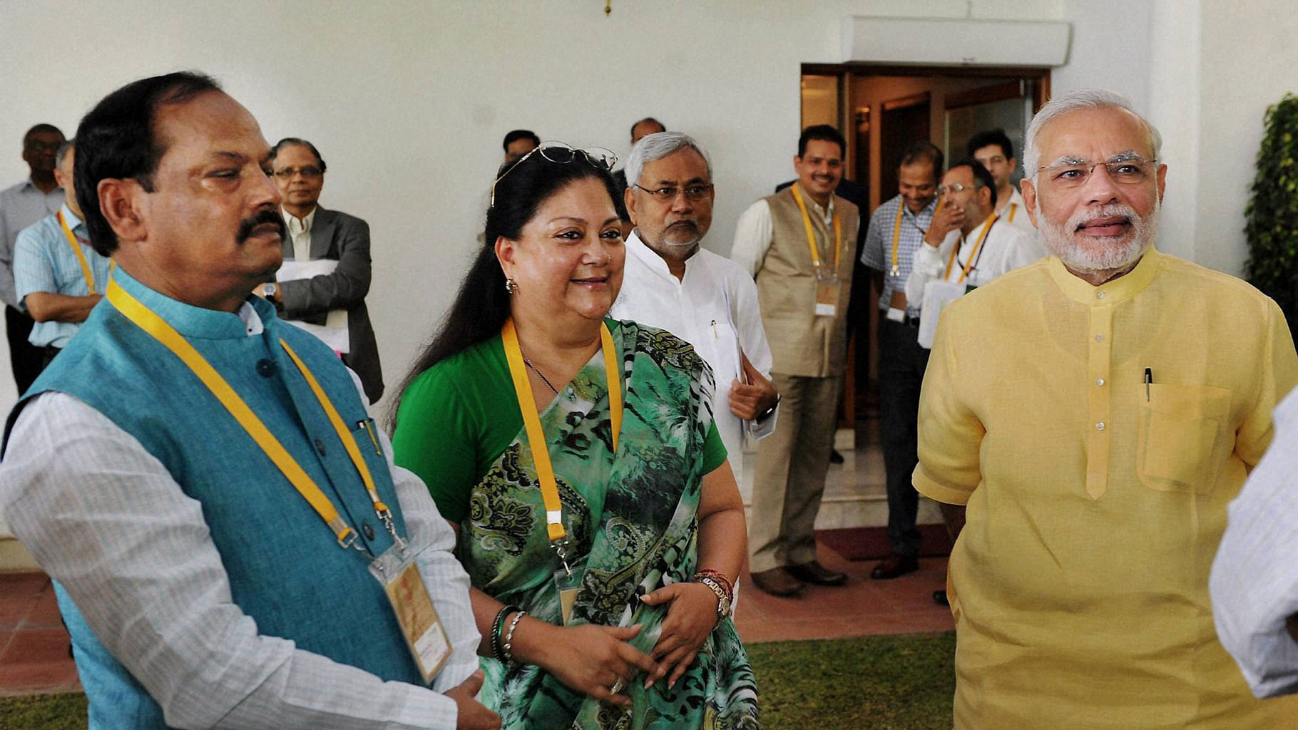  Prime Minister Narendra Modi interacts with Jharkhand CM Raghubar Das (left) and Rajasthan CM Vasundhara Raje (centre) ahead of  NITI Aayog’s second Governing Council meeting in New Delhi.(Photo: PTI)