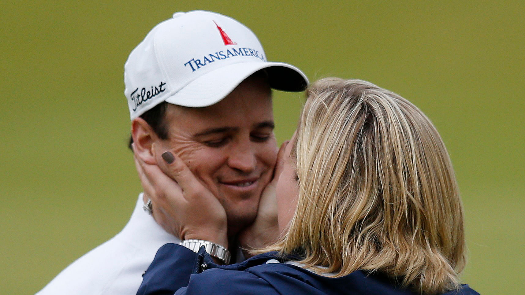 Zach Johnson hugs his wife Kim Barclay after winning the British Open on Monday. (Photo: Reuters)