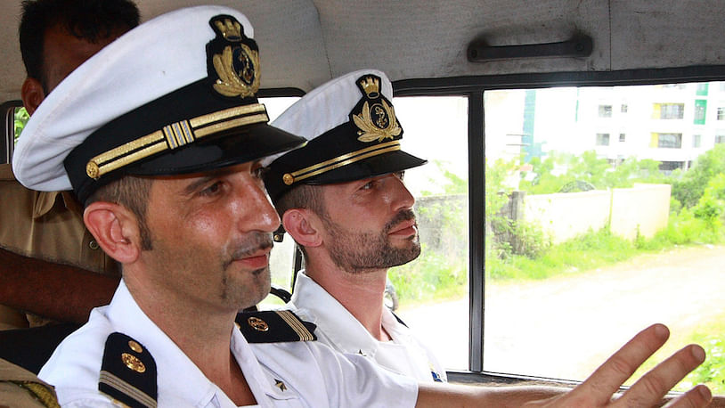  Italian sailors Massimiliano Latorre (left) and Salvatore Girone in a police vehicle after they appeared in a Kochi Court. (Photo:Reuters)