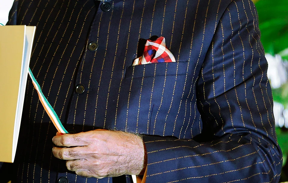 A close-up view of Prime Minister Narenda Modi’s dark pinstripe suit, repeatedly embroidered with the words “Narendra Damodardas Modi”. (Photo: Reuters)