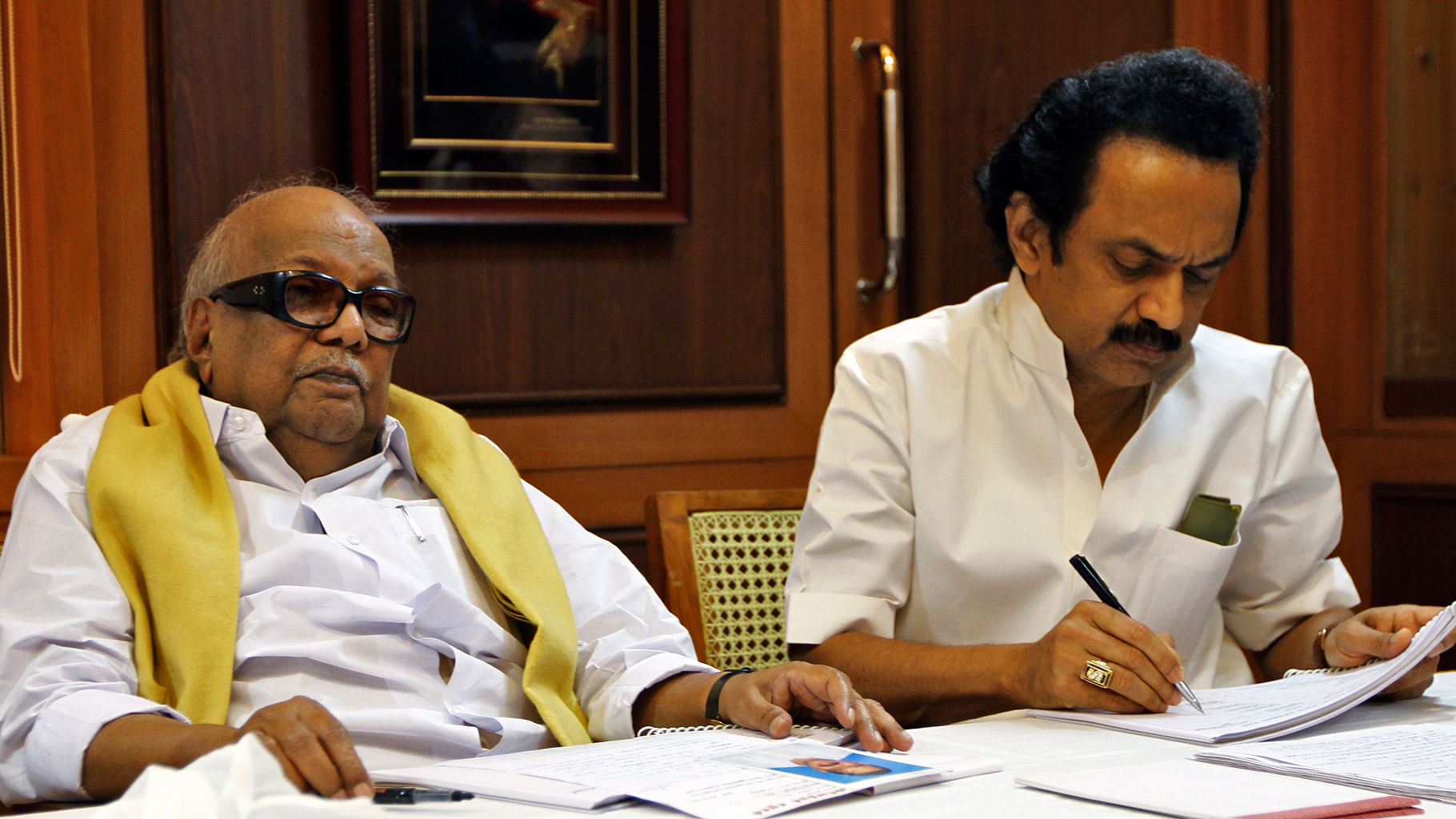 M. Karunanidhi (L)former Chief Minister of Tamil Nadu and leader of Dravida Munnetra Kazhagam (DMK) party attends a meeting besides his son M.K. Stalin, a DMK leader. (Photo: Reuters)