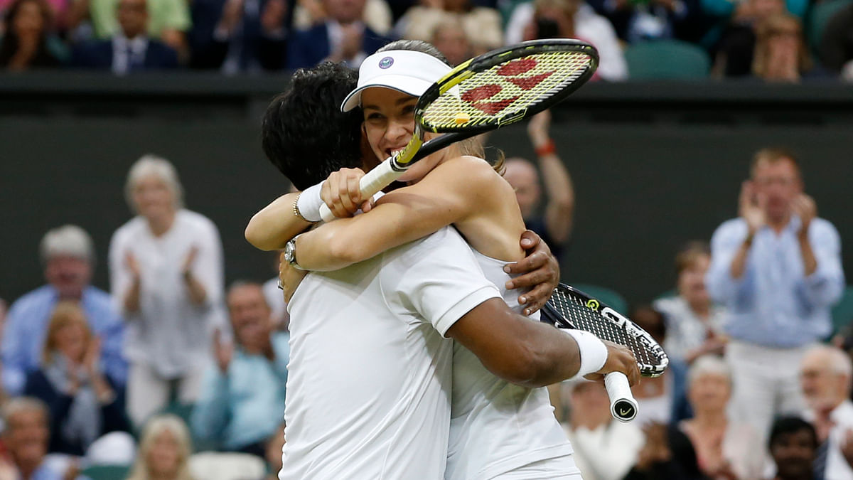 Leander Paes & Sania Mirza won doubles titles at Wimbledon. They  had one common factor, a partner in Martina Hingis.