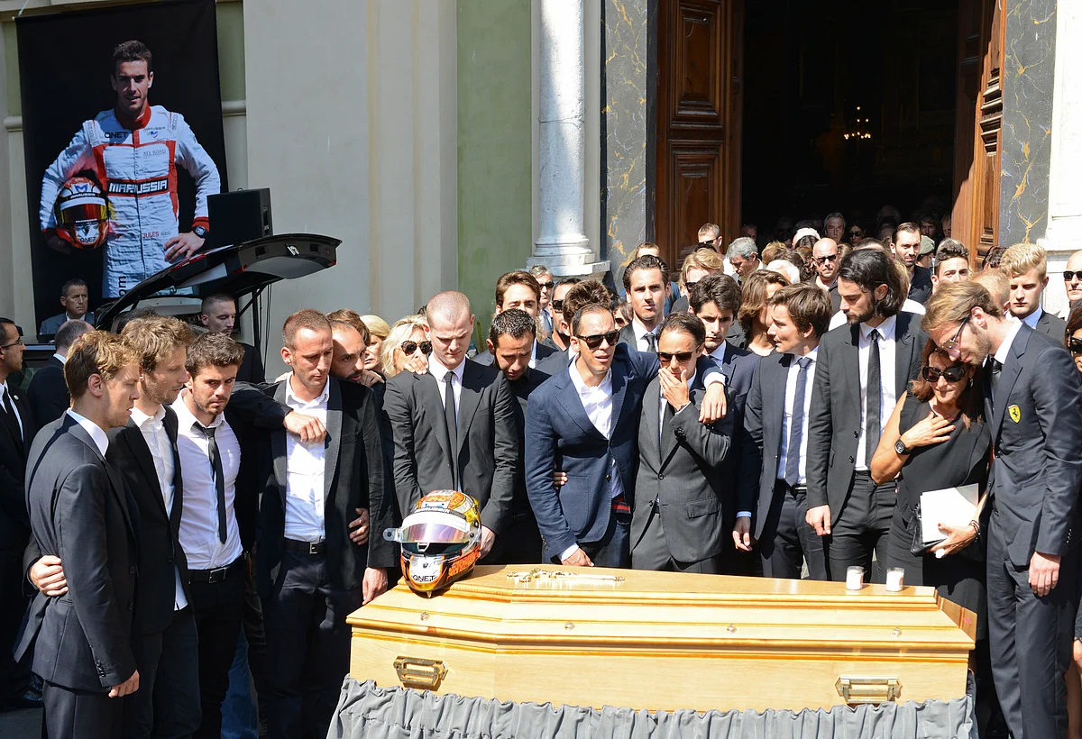 Friends and Formula One drivers gather around the coffin of late Marussia F1 driver Jules Bianchi during the funeral ceremony. (Photo: Reuters)